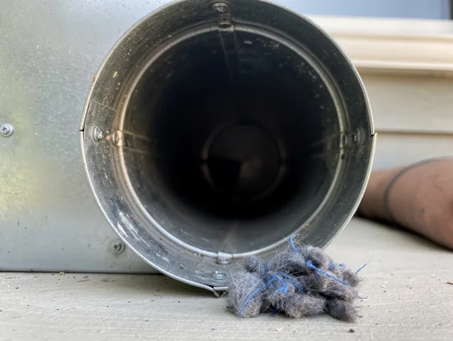 Hanover Dryer Vent Cleaning technician using specialized equipment to clear severe dryer vent blockage in Hanover
